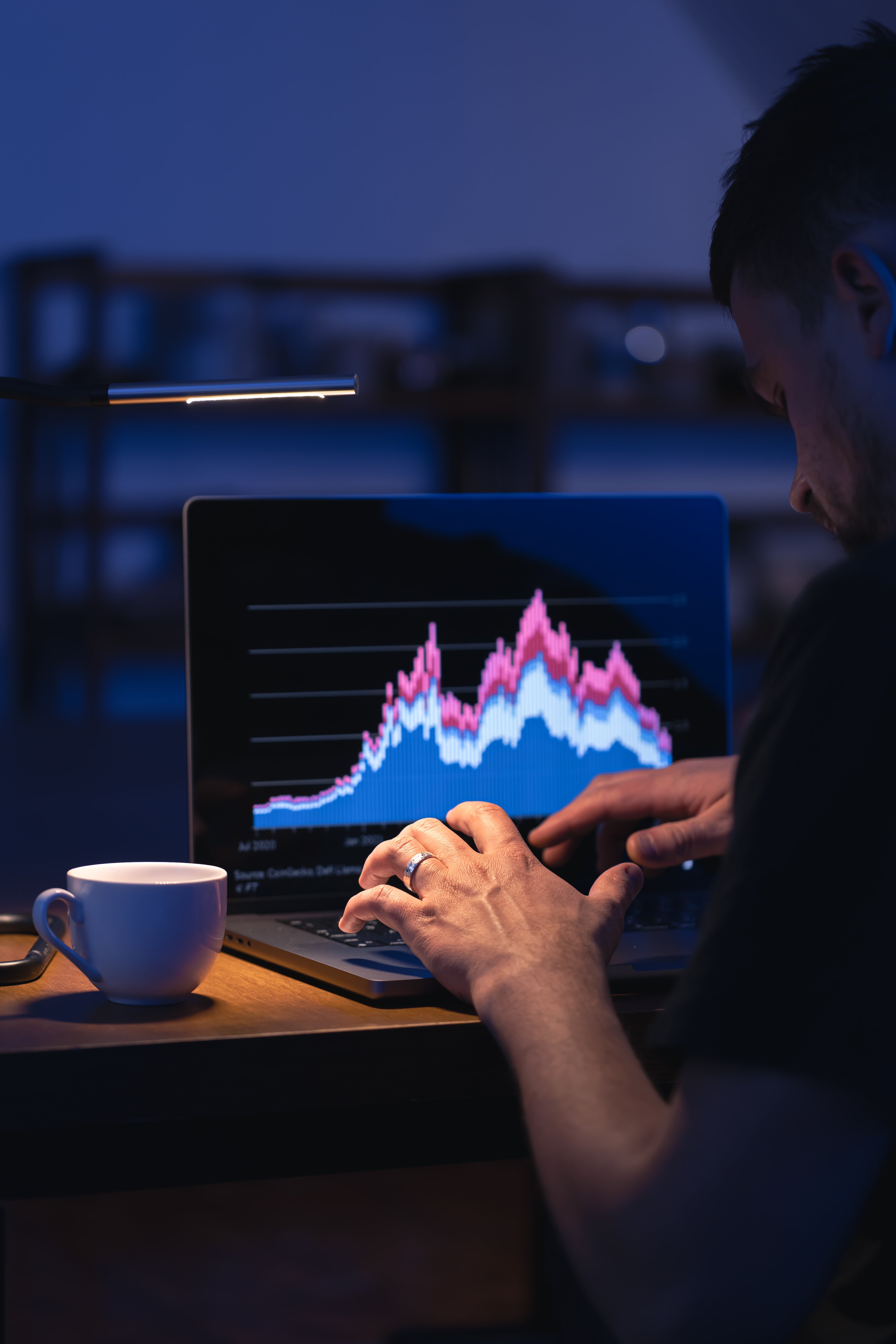 broker-looking-at-laptop-analyzing-stock-market-in-2026-03-20-03-17-07-utc