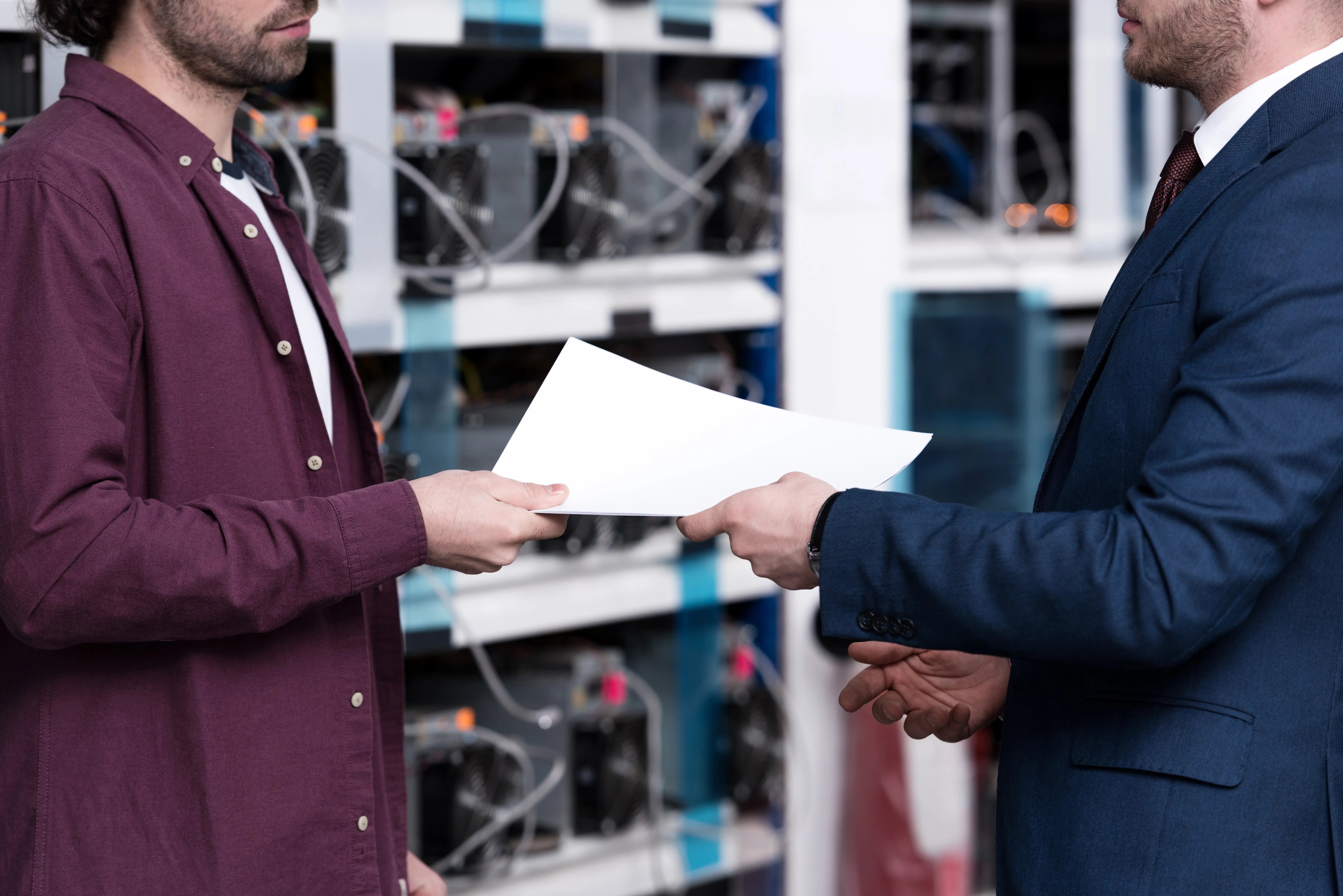 cropped-shot-of-businessman-and-computer-engineer-2024-11-17-22-12-59-utc