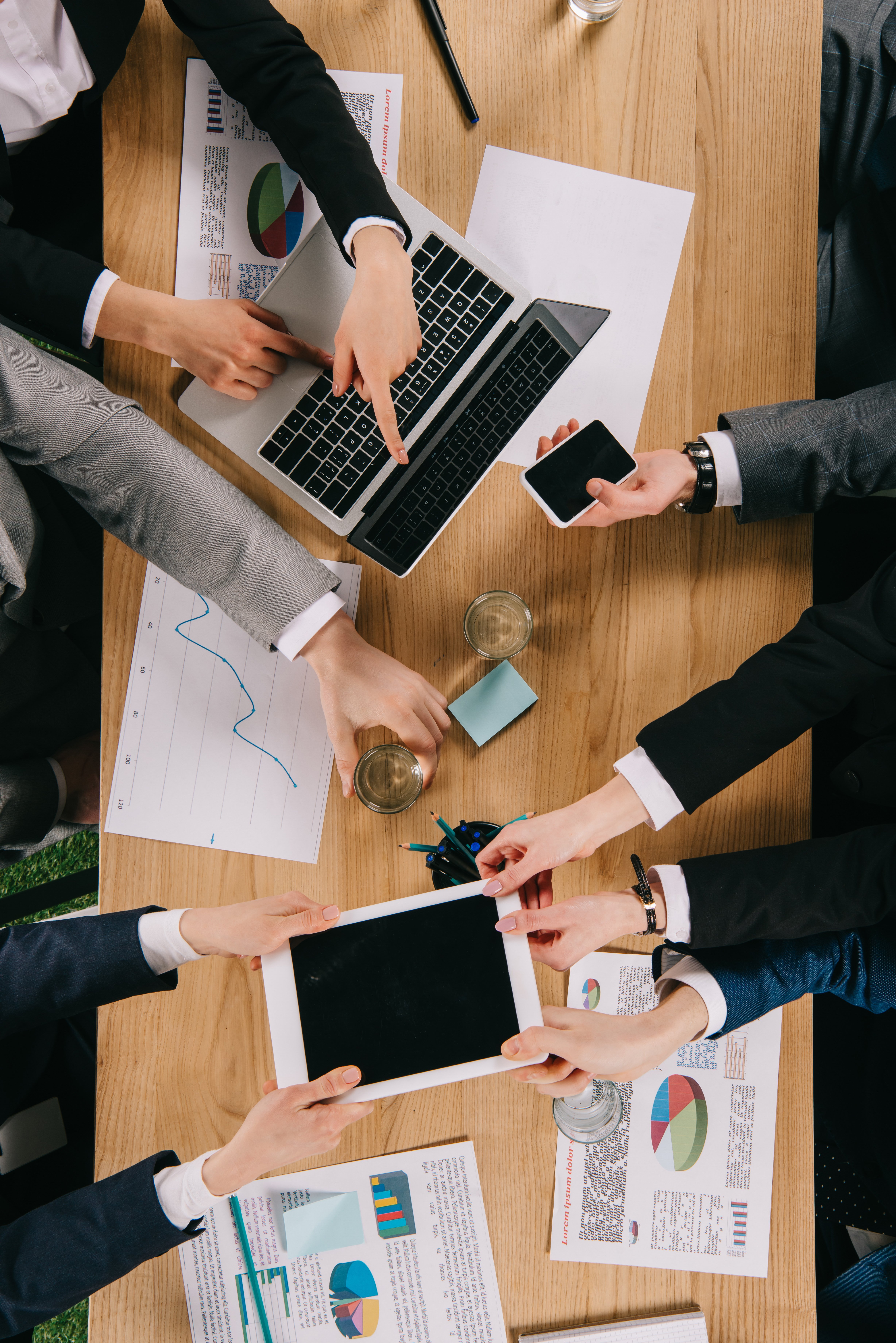 cropped-view-of-business-partners-sharing-digital-2026-01-06-00-25-33-utc