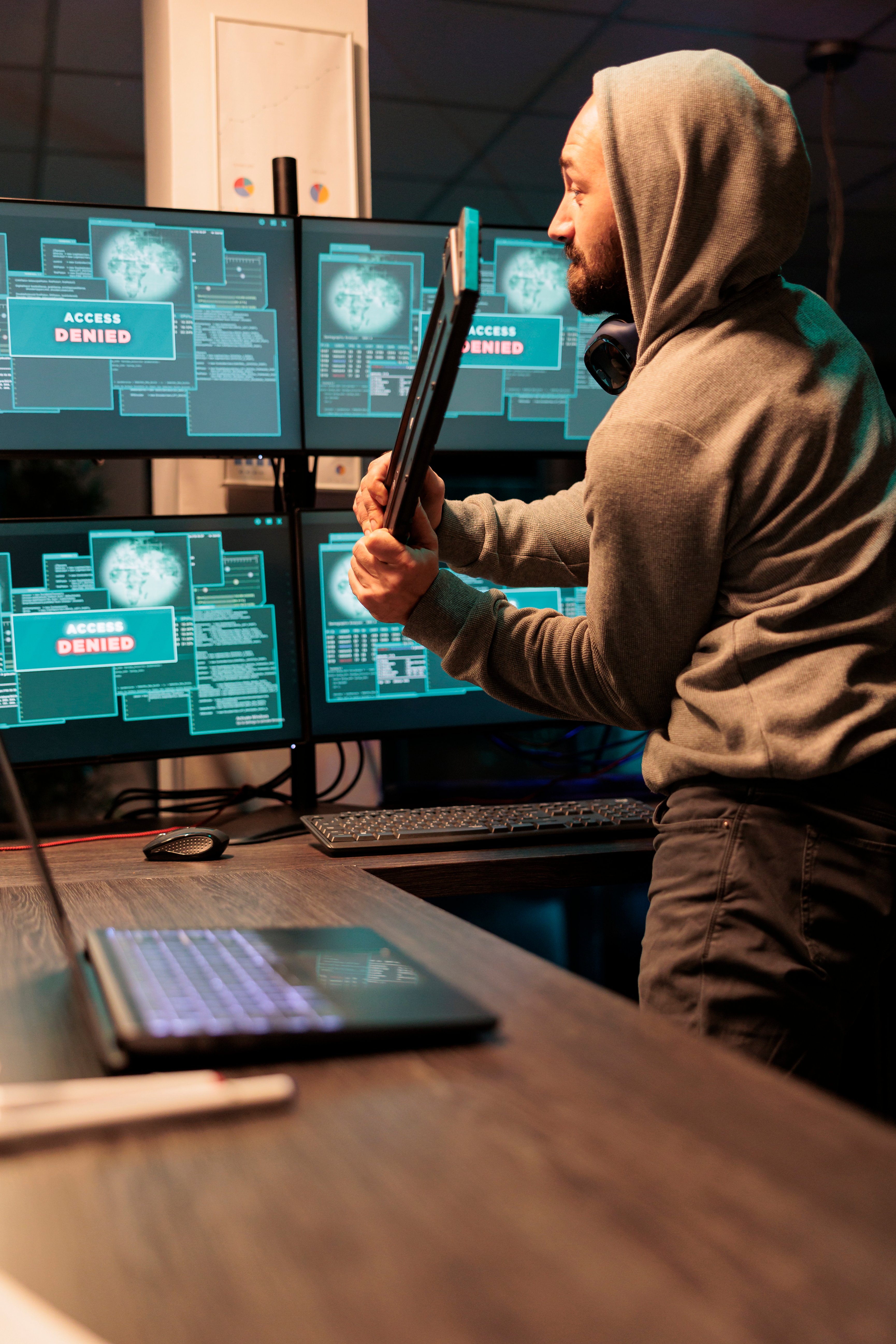 displeased-angry-hacker-throwing-keyboard-in-offic-2025-02-17-05-45-32-utc