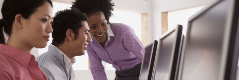 employees looking at computer screens