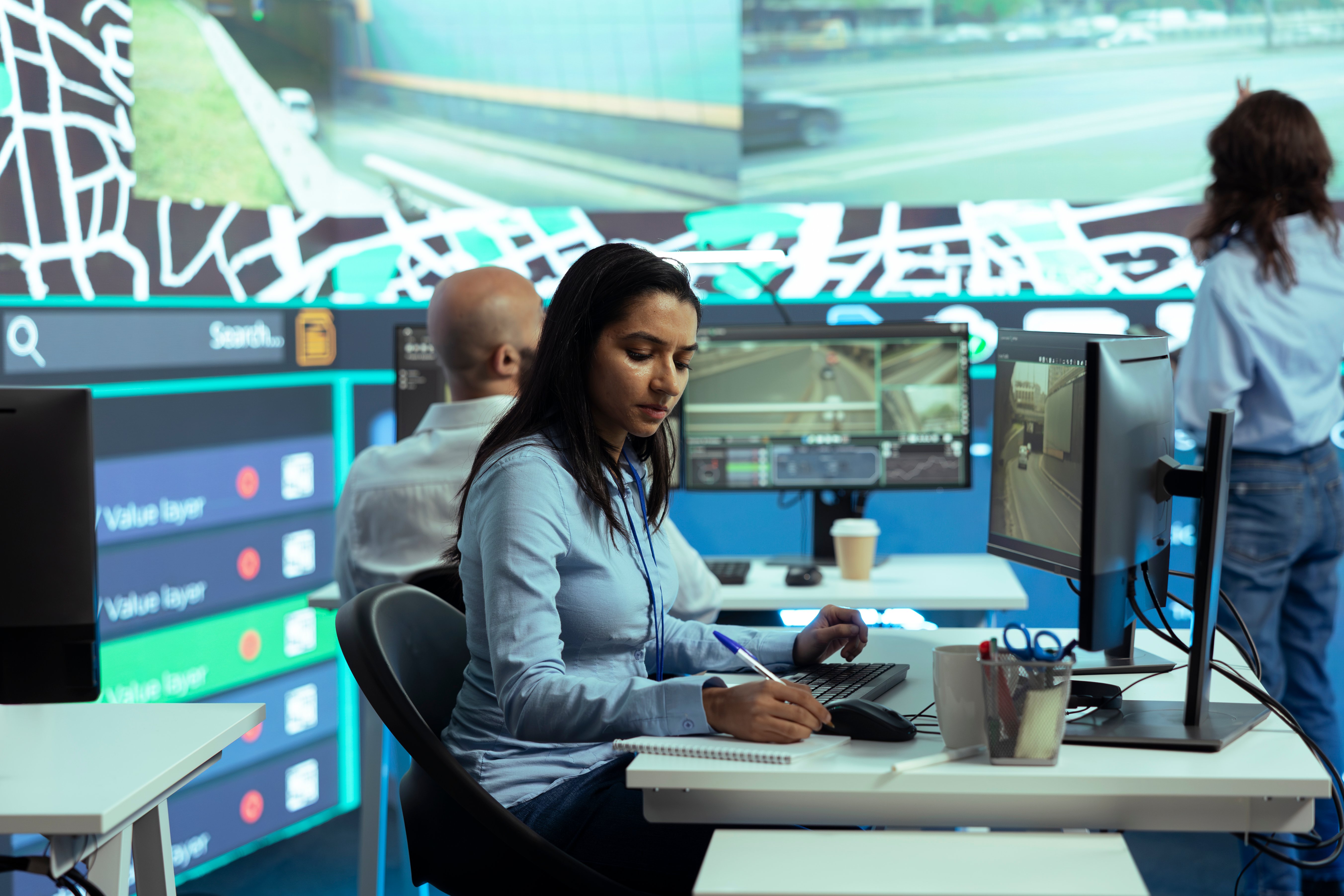 indian-woman-employee-locating-delivery-truck-driv-2025-02-20-06-39-15-utc