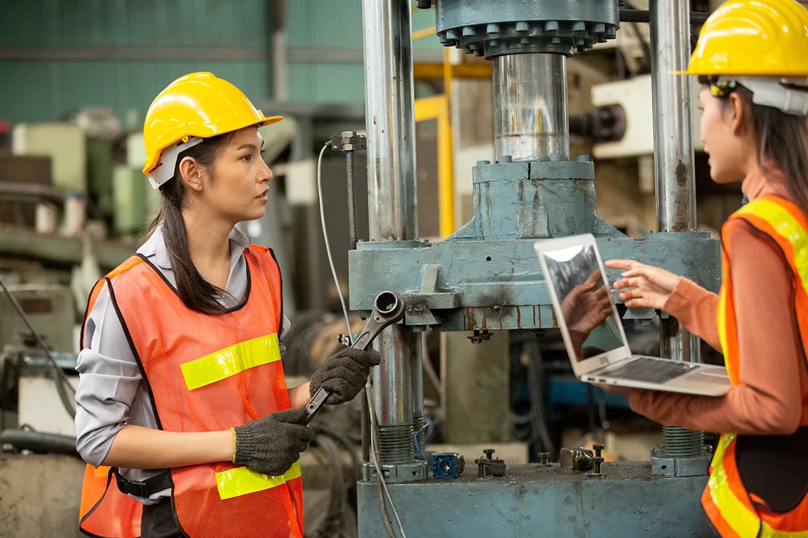 Industrial workers in metal factory