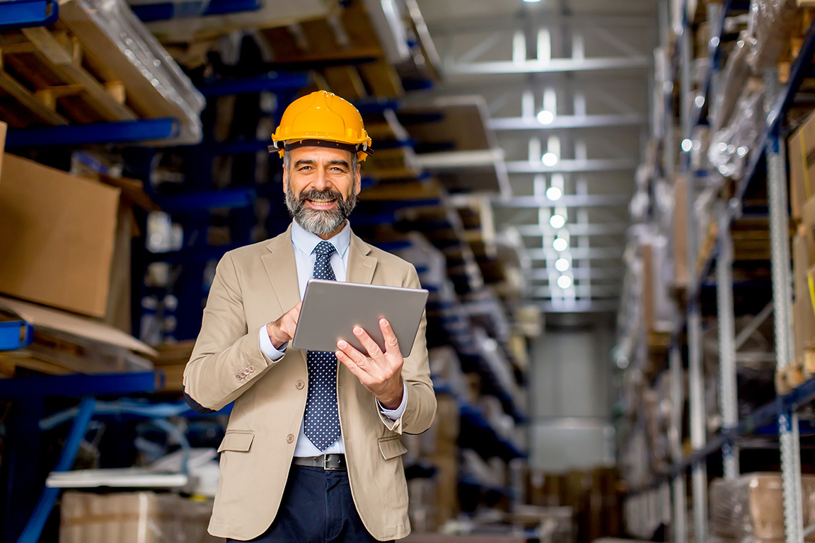 Mature engineer in a warehouse