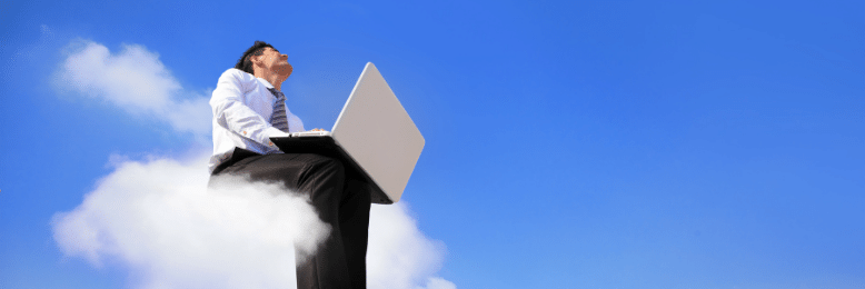 person sitting on a cloud with his laptop