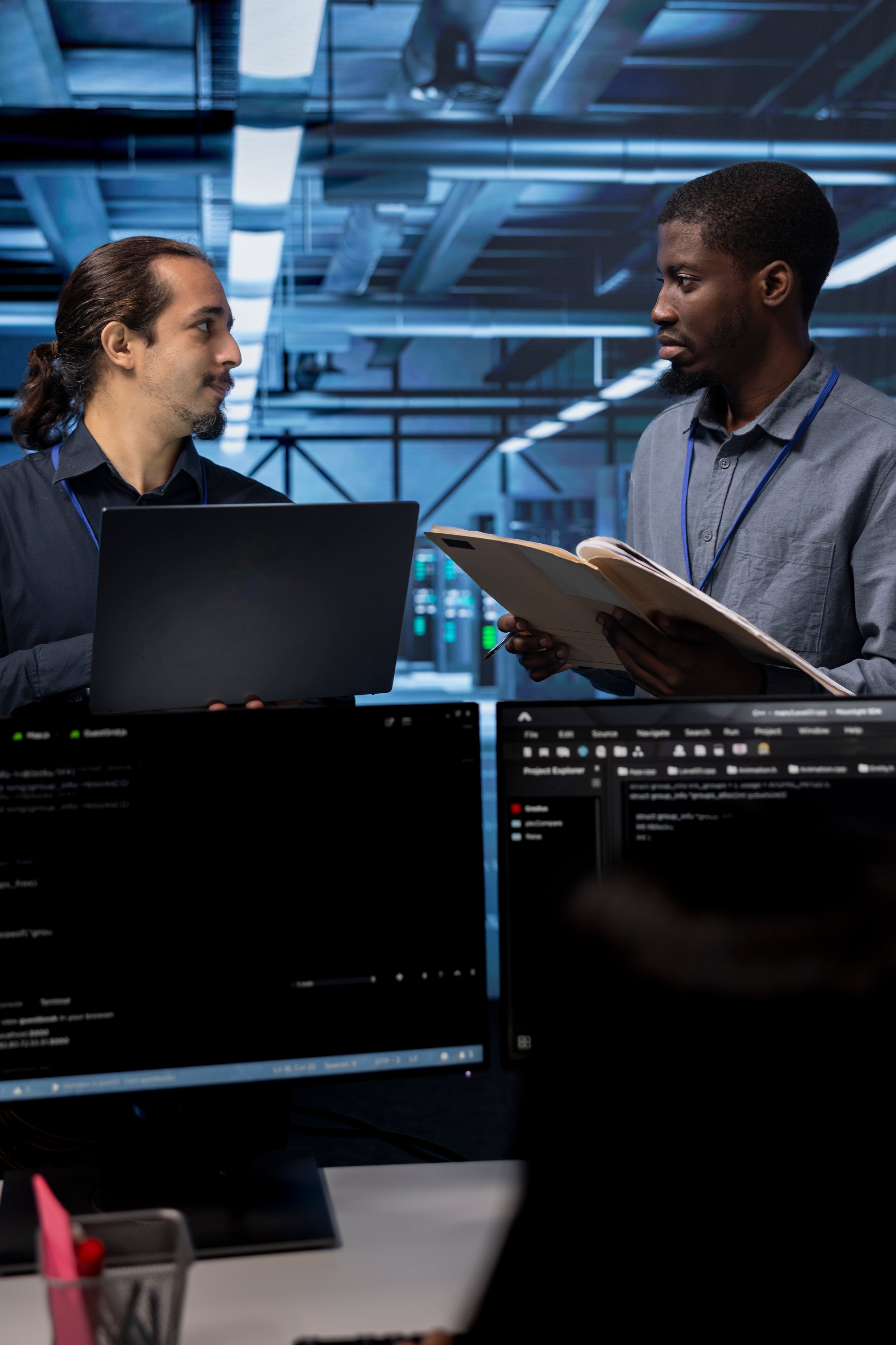 supervisor-talking-with-workers-in-server-room-as-2025-02-19-23-34-07-utc