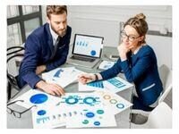 two people going over data
