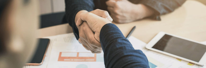 two people shaking hands making an agreement