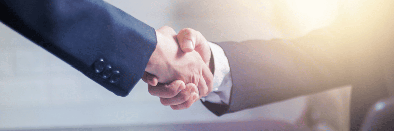 two people shaking hands signifying a partnership