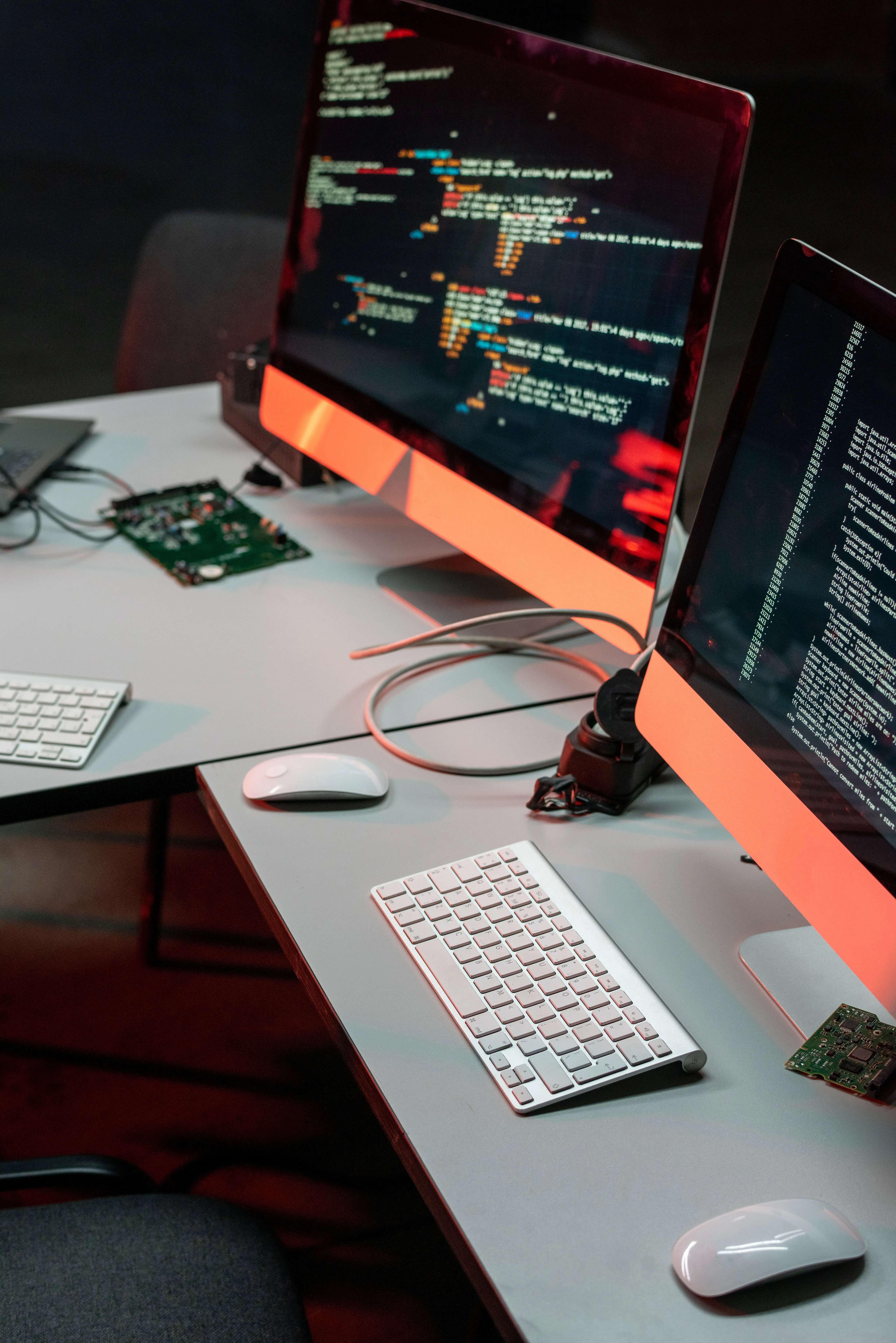 two-computer-monitors-with-coded-data-2025-04-02-11-03-04-utc