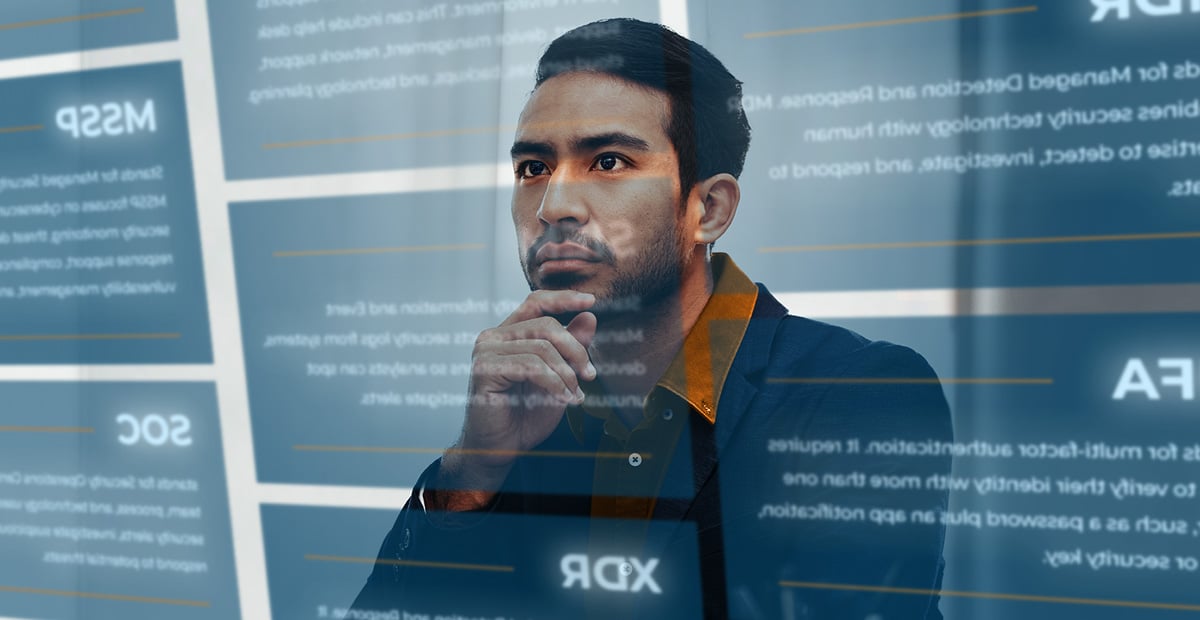 Business professional reviewing MSP and MSSP terms to compare managed IT services, cybersecurity, and technology providers.
