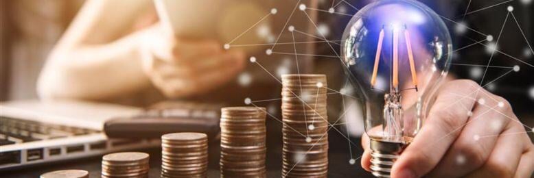 Rising IT costs illustrated by stacked coins, highlighting how cheap IT support can become more expensive.