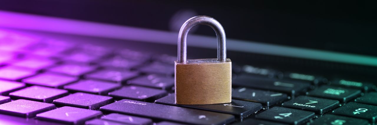 a padlock on top of a laptop keyboard