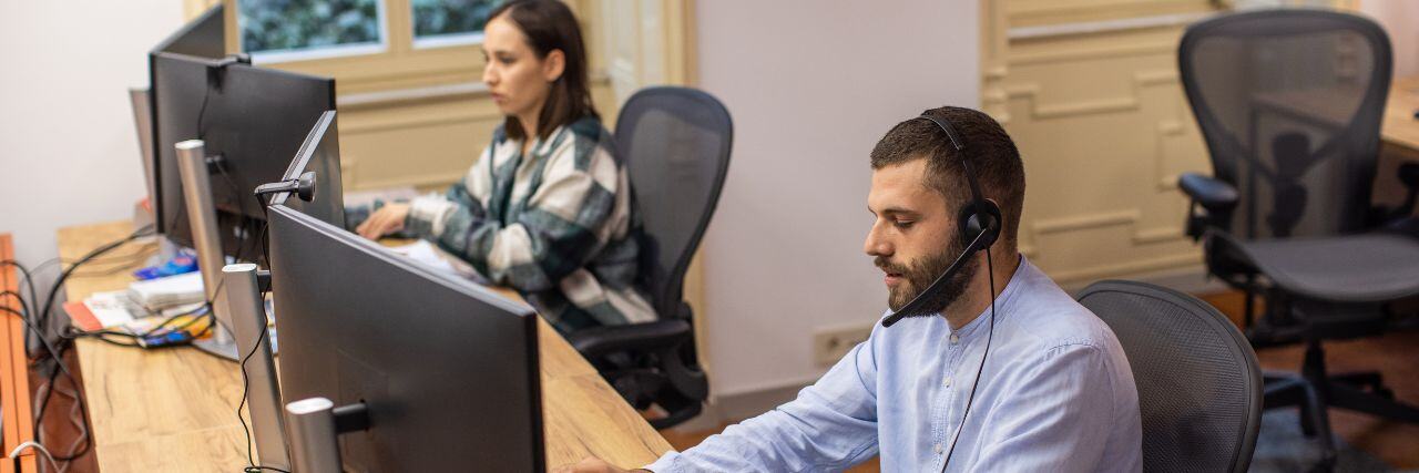 managed service technicians sitting in front of the computer providing support to the public sector