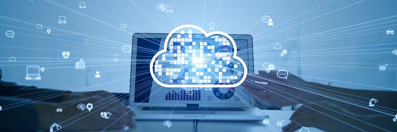 a holographic image of a cloud on top a laptop with IT providers beside it