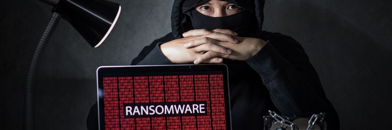 A hacker getting into your system using ransomware attack