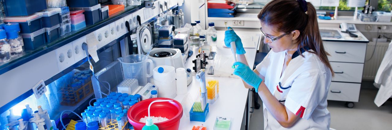 a person doing biotechnology work in the laboratory