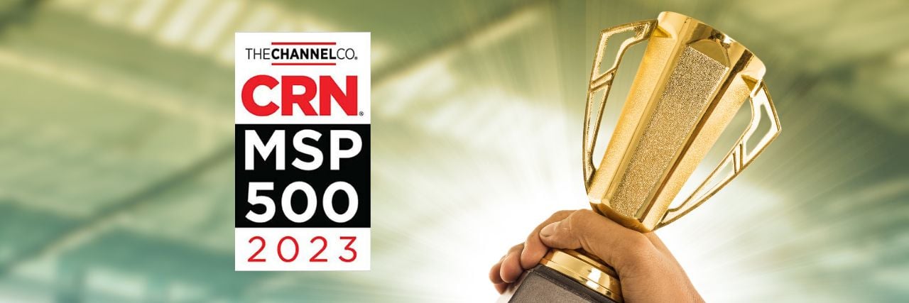 a person holding a trophy with the CRN MSP 500 2023 logo beside it