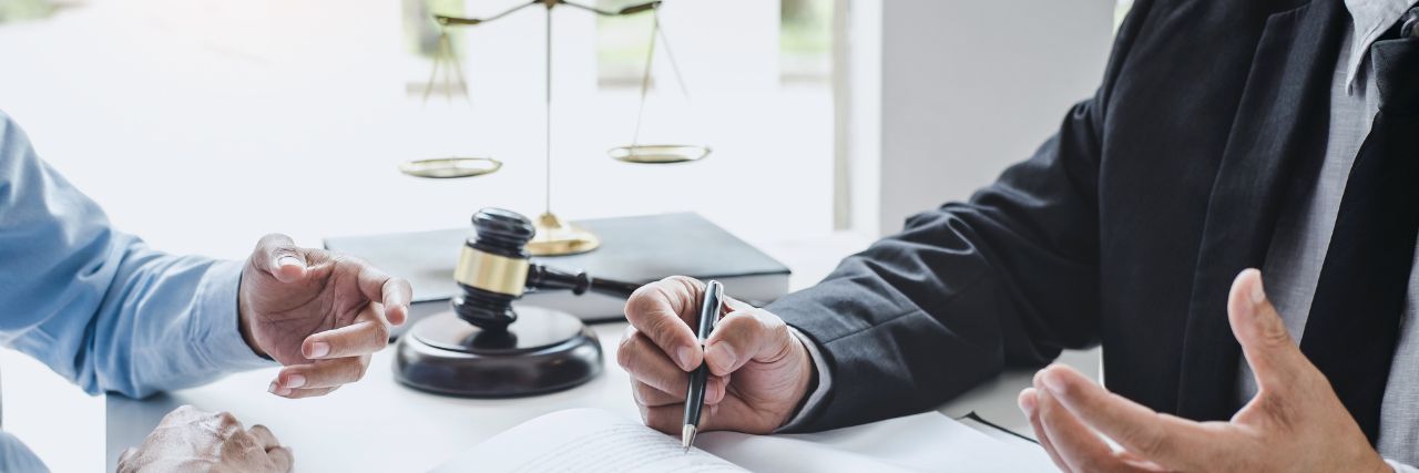 two people in a law firm discussing the main benefits of Managed IT Services