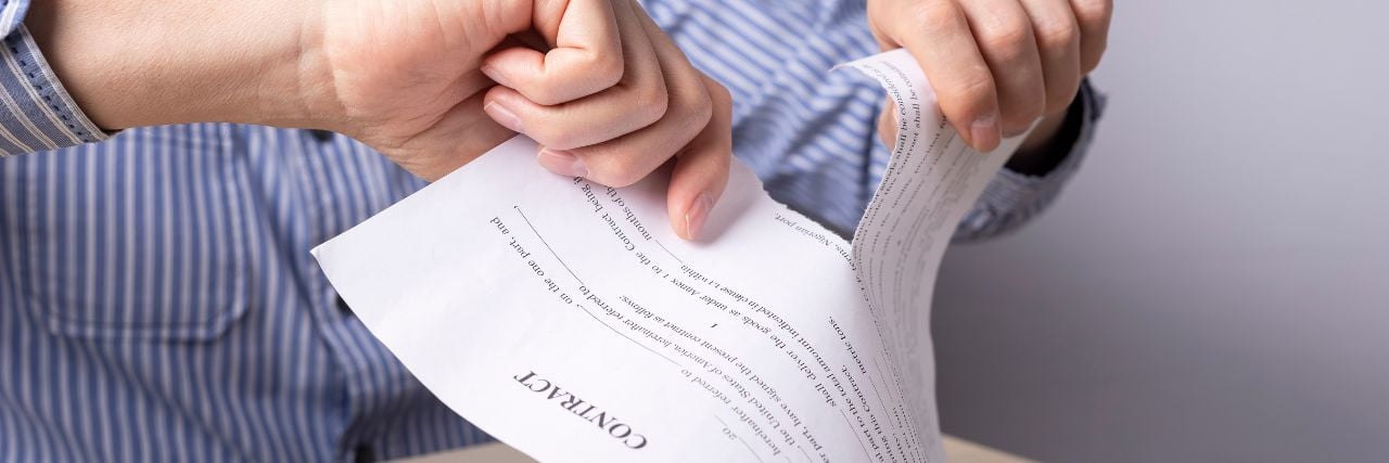 a person tearing up a contract because they want to leave their MSP
