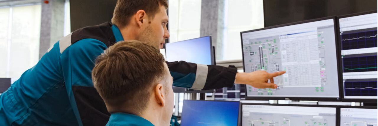 two people discussing infrastructure monitoring for the business