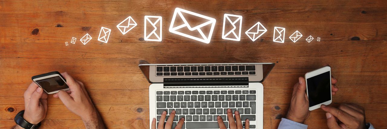Multiple people communicating through email implementing MFA