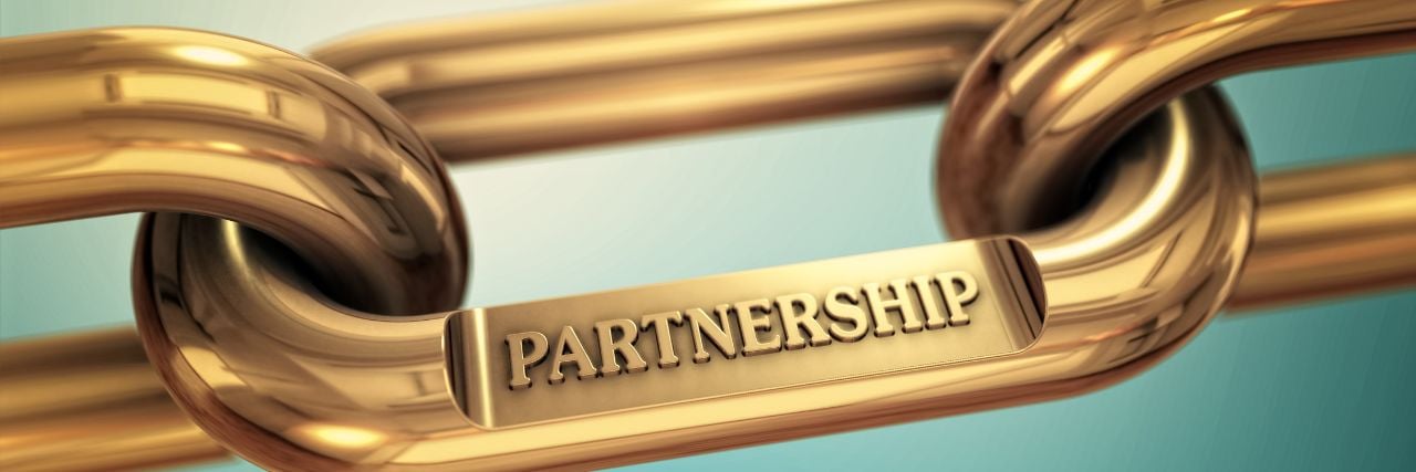 a chain link with the word partnership written on it