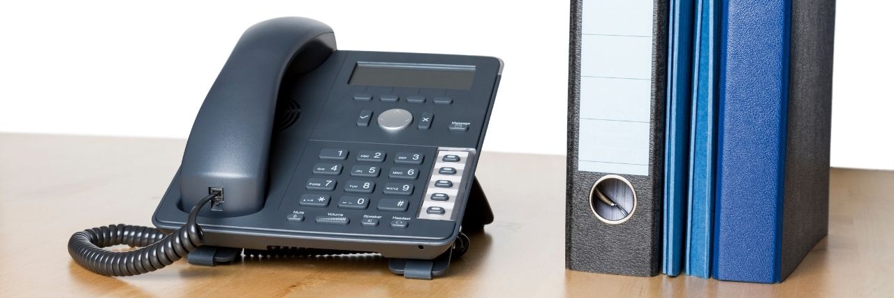 Phone on a desk with parked calls