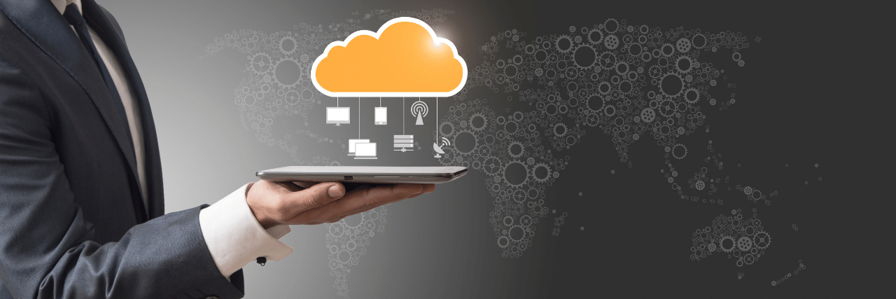 a hand holding a device using cloud computing