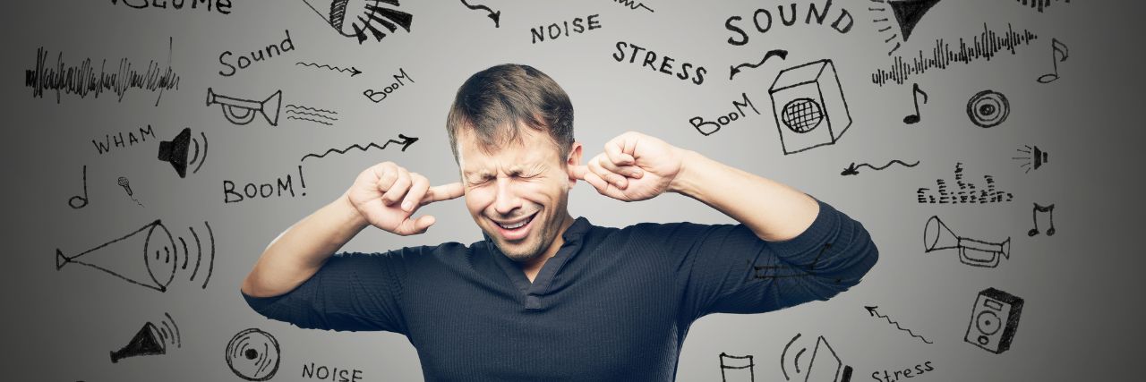 A person covering his ears from the news