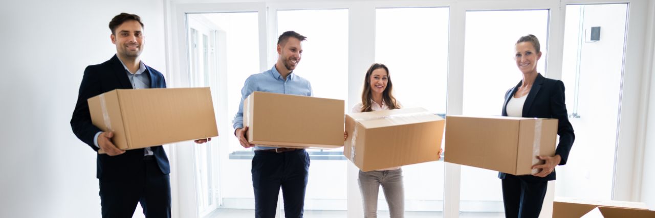 employees preparing their technology for seamless office relocation