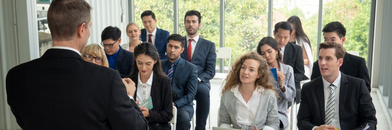 A person giving out a cybersecurity training to employees