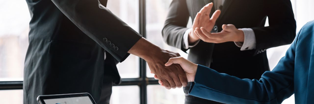 two people closing a deal