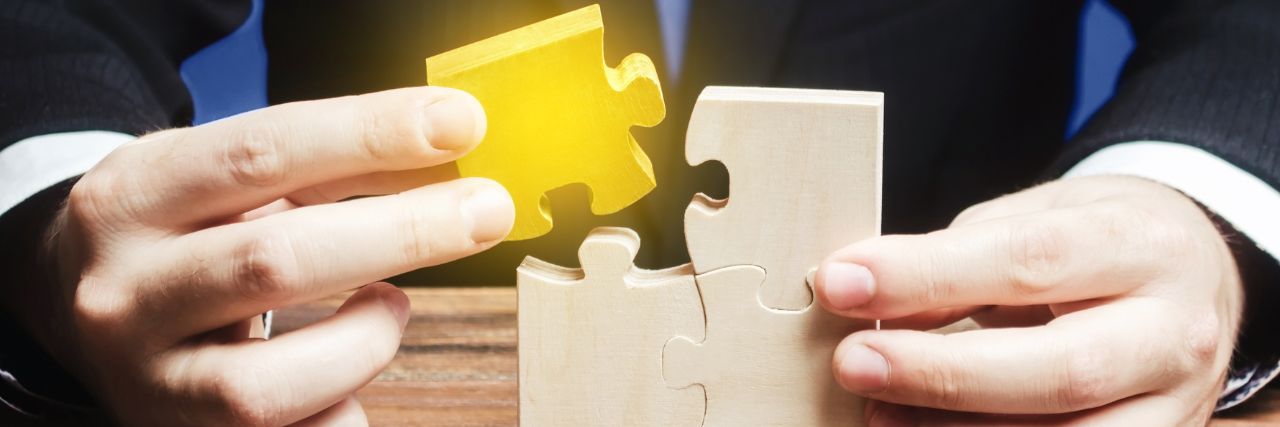 a person finding the piece that completes the puzzle