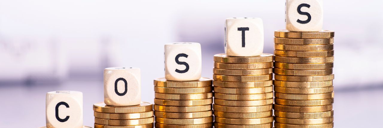 costs stacked on top of coins