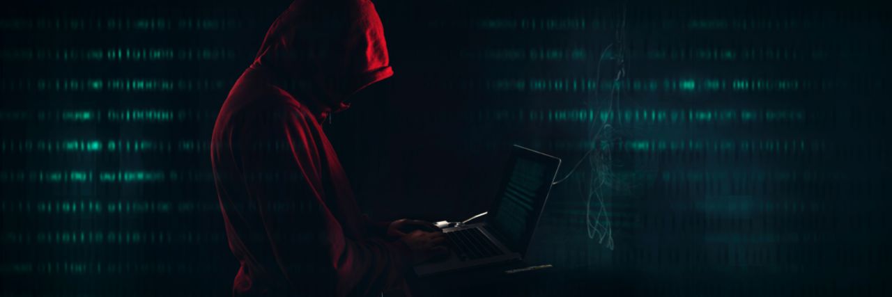 a hacker doing a search in the dark web