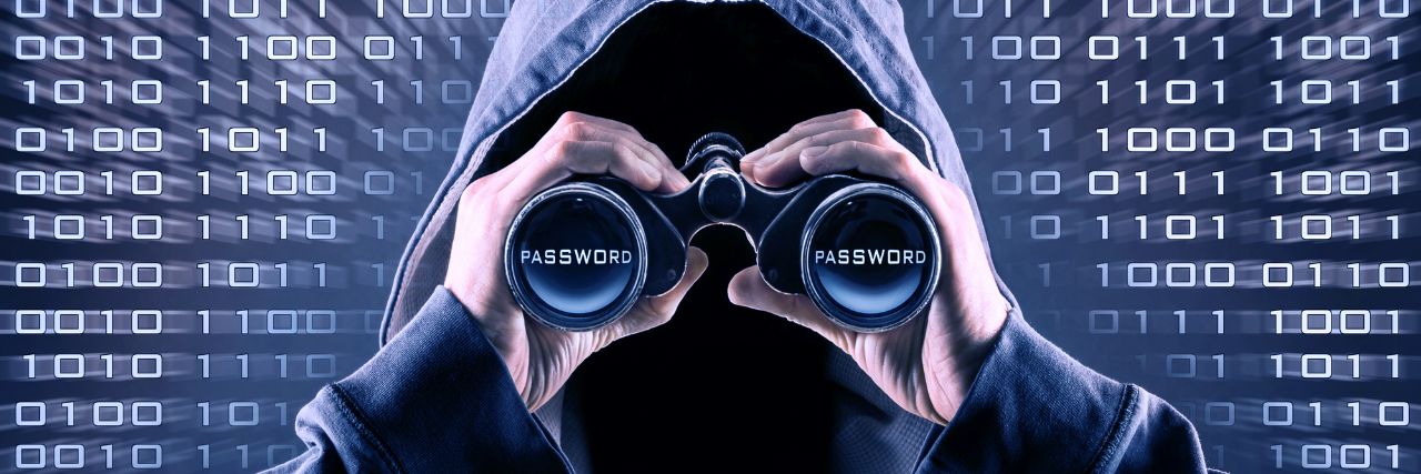 a hacked looking into binoculars to hack your password