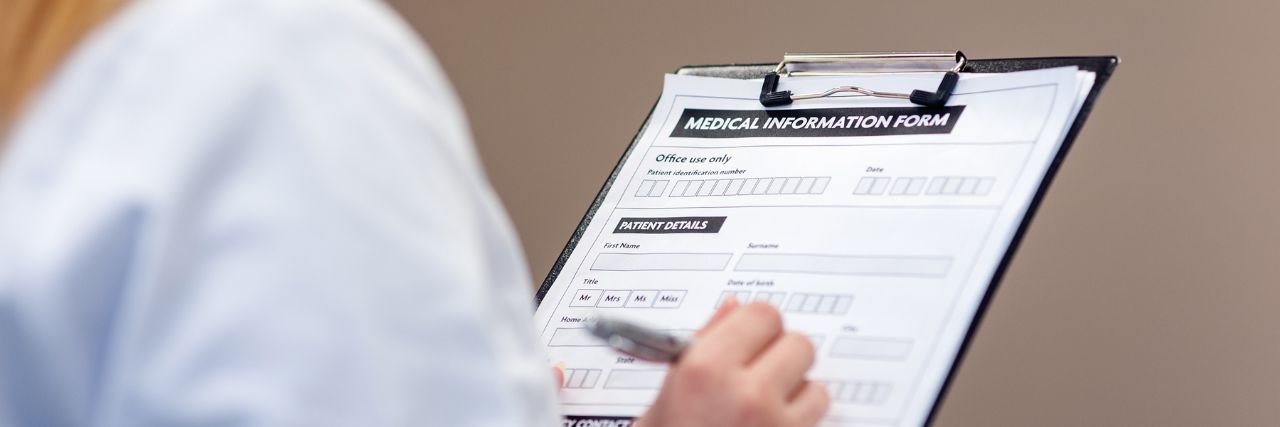 a person filling in medical information
