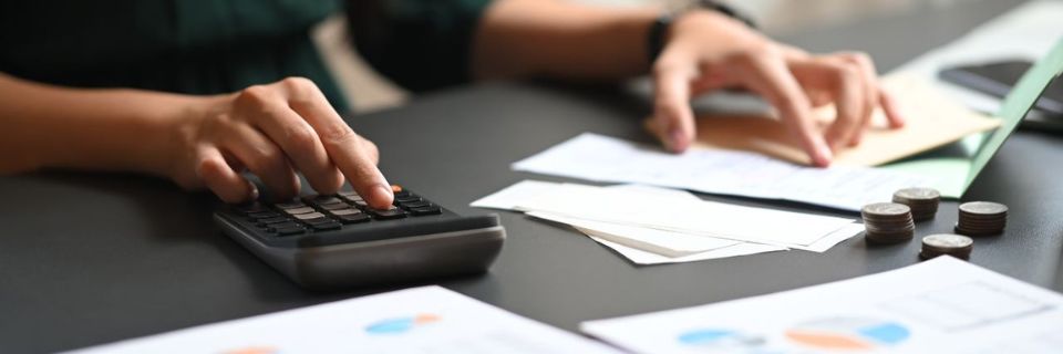 a person using the calculator to compute the rising cost of cyber insurance