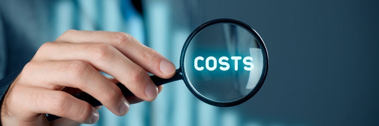a person holding a magnifying glass with the word costs in it
