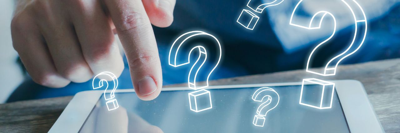 a person using a tablet with questions about cybersecurity