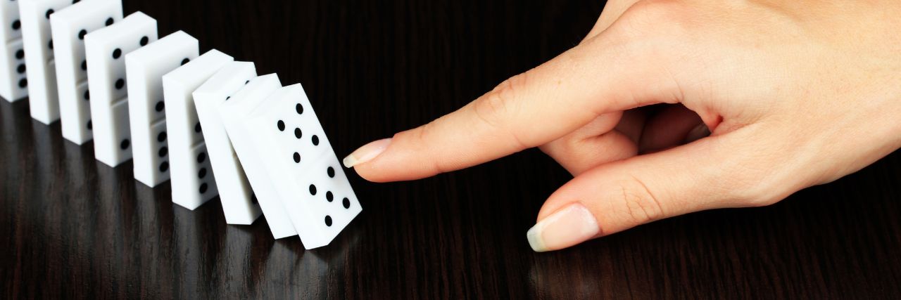 a person pushing domino tiles