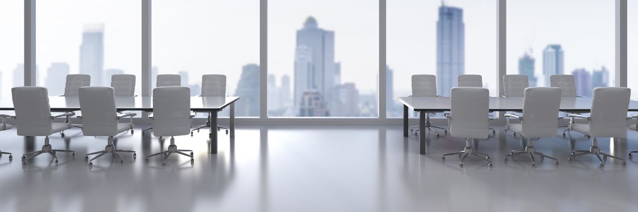 an empty wireless conference room overlooking the skyline