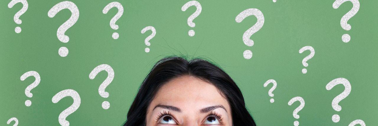 a person with a lot of question marks on top of her head regarding the GDPR compliance cost of 2024