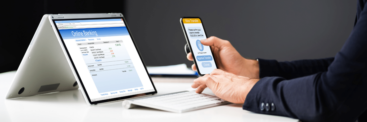 A person doing online banking using two-factor authentication for added protection