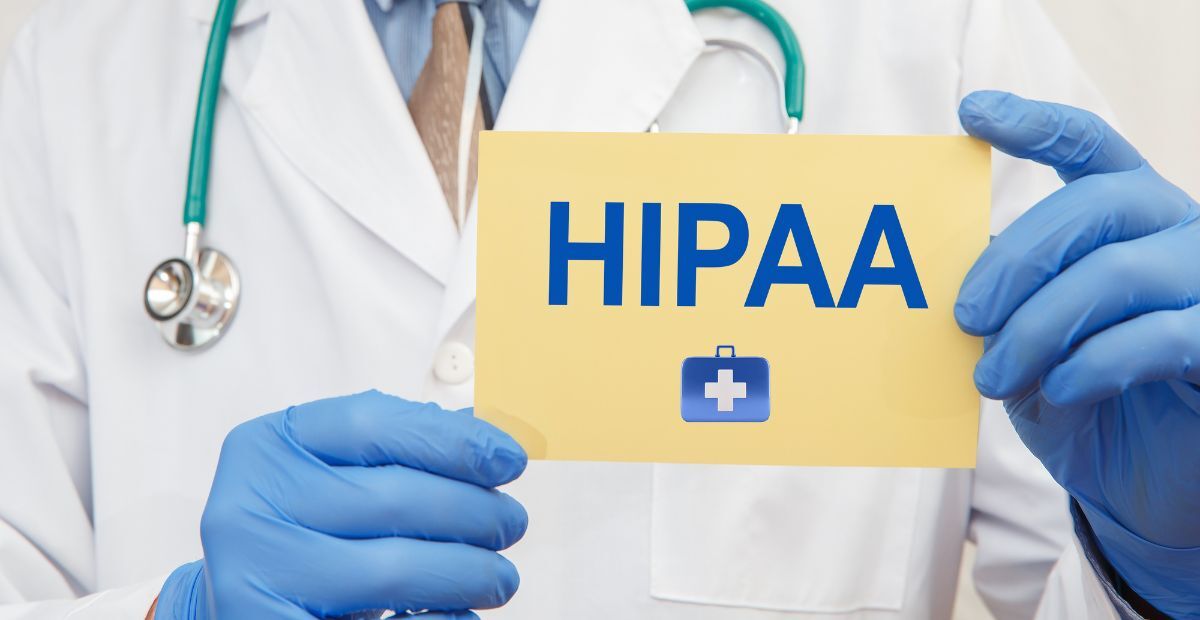 a medical personnel holding a sign with the word HIPAA written on it 