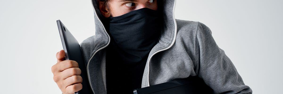A hacker getting away with identity theft