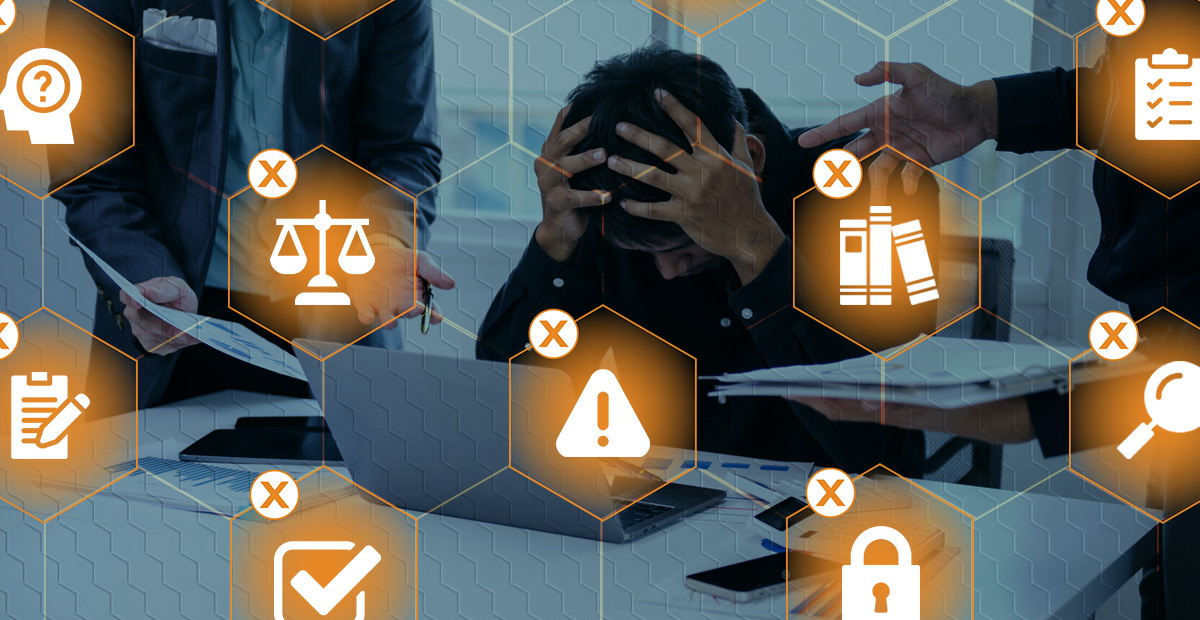 Overwhelmed executive facing audit and security alerts, highlighting the hidden challenges businesses face when proving compliance.