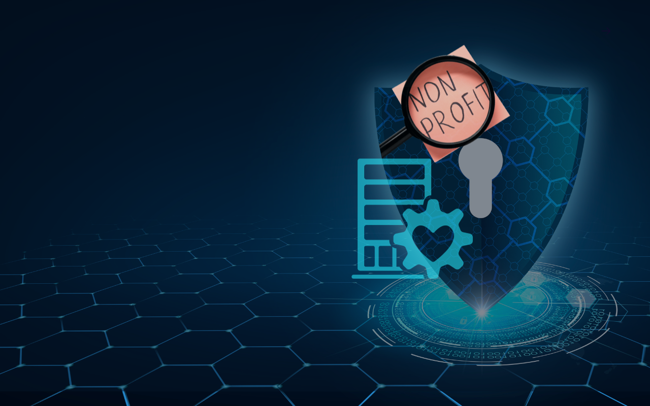 Shield with a magnifying glass over a Non Profit note, representing nonprofit cybersecurity