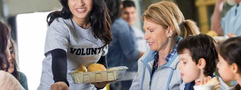 Union Station Homeless Services volunteers handing out food